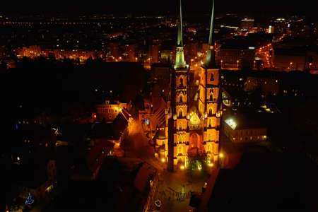 Aerial view of night Wroclaw cityscape panorama in Poland. Cathedral of St. John on Tumski island, bird eye viewの写真素材