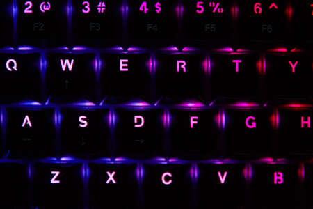 Gaming keyboard, close up. Mechanical rgb keyboard for computer games on dark backgound