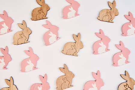 Pattern with wooden rabbit on white background, Happy Easter cardの写真素材