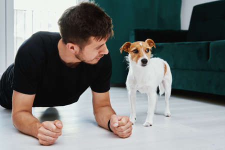 Man doing sport exercises at home, Sport training at home, Helathy lifestyle concept