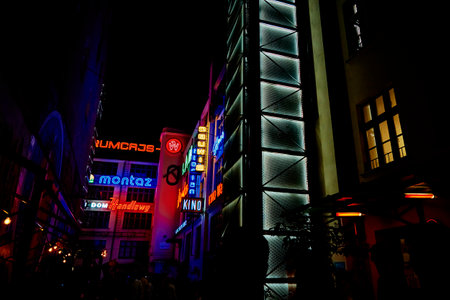 Ruska street in Wroclaw city with glowing neon signs on buildings at night. Wroclaw, Poland - July 29, 2021のeditorial素材