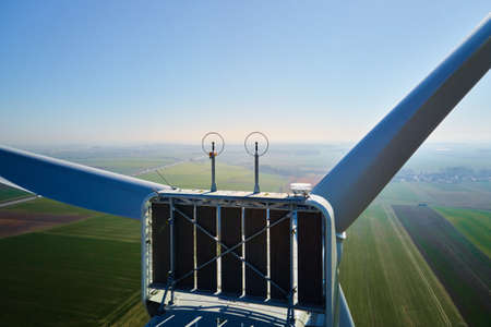 Aerial view of close up windmill turbine in countryside area, Wind power and renewable sustainable...