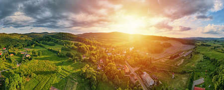 Overhead view of beautiful landscape at sunset, Aerial view of countryside area with village and...