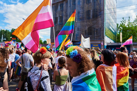 People crowd with LGBTQ rainbow flags on pride parade. Tolerance, diversity and gender identity concept. Wroclaw, Poland - June 11, 2022のeditorial素材