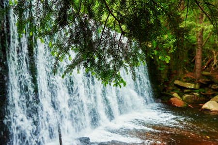 Waterfall on Lomnica river in Karpacz mountains in Poland, Beautiful nature landscape