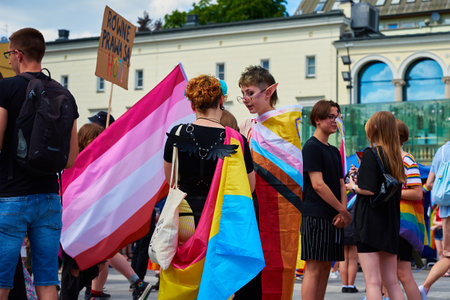 People with LGBTQ rainbow flags on pride parade. Tolerance, diversity and gender identity concept. Crowd on demonstration at city street. Wroclaw, Poland - June 11, 2022のeditorial素材