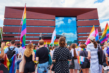 People with LGBTQ rainbow flags on pride parade. Tolerance, diversity and gender identity concept....