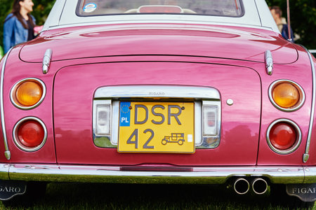 Pink Nissan Figaro retro classis car, back view. Katy Wroclawskie, Poland - May 28-2022のeditorial素材