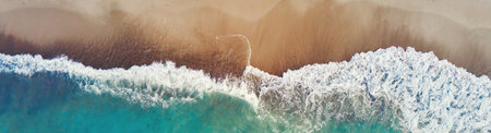 Sand beach with sea waves, top view. Summer vacation and travel concept. Beautiful coastline with...