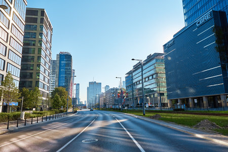 Administrative center in Warsaw, Business office buildings in downtown central district, Skyscrapers with glass facade against blue sky. Warsaw, Poland - September 4, 2022のeditorial素材