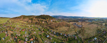 Drone flight over mountain village among green agricultural fields, Countryside view, Nature landscape panoramaの写真素材