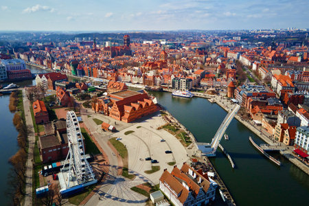 Aerial view of ferris wheel attraction in Gdansk city, Poland. Panoramic view of touristic place in european cityの写真素材