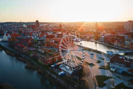 Aerial view of ferris wheel attraction in Gdansk city, Poland. Panoramic view of touristic place in...