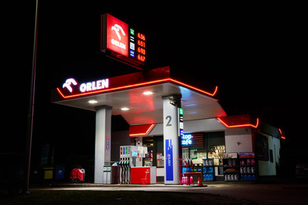 Orlen gas station for refueling car and cafe at nightのeditorial素材