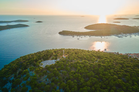 Panoramic view of islands in Adriatic Sea and hedge maze among forest trees at sunset. Lavender labyrinth in Rogoznica, Croatia. Aerial view of coastal landscape. Place for summer vacationの写真素材