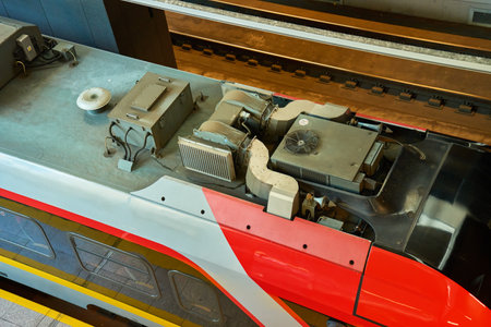 View of roof of new red and grey electric train showing ventilation system. Close-up details of the...