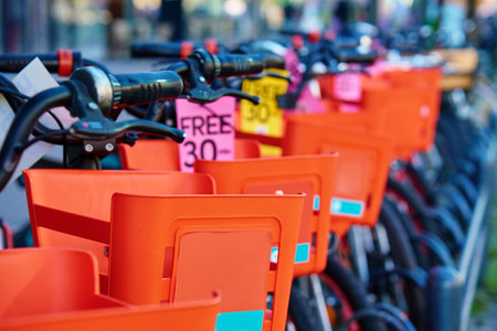 Detailed close-up of shared bicycles parked in urban bike rack. Sustainable transportation in Copenhagen cityの写真素材