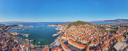 Aerial view of Split, Croatia. Panoramic cityscape of coastal touristic city with harbor. Old town with historical red roof tiled buildings near Adriatic Seaの写真素材