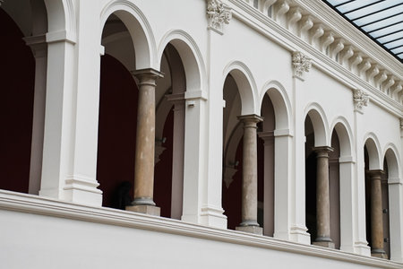 Interior view of classic building with white arches and columns. Concept of culture, architecture and historyの写真素材