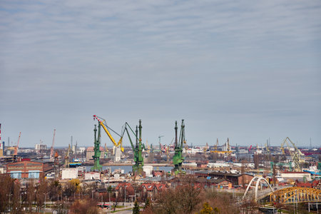 Panoramic view of shipyard with port cranes, industrial buildings and harbor infrastructureの写真素材