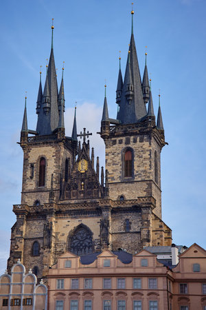 View of Gothic Church of Our Lady before Tyn with two tall spires and historic buildings in Old Town Square of Prague, Czech Republic. Concept of travel and European architectureの写真素材