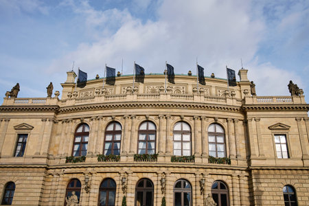Front view of historic government building with black flags on the roof as sign of mourning. Concept of national grief and respect for victimsの写真素材