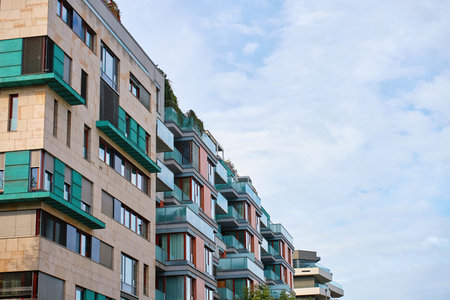 Modern residential building facade with glass balconies and geometric details. Contemporary urban architectureの写真素材