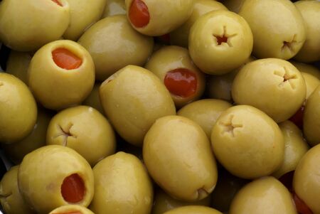 Close up of some isolated green olives.