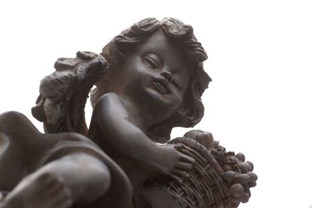 Isolated angel with fruit basket.