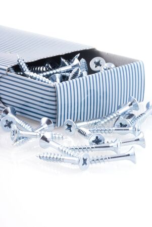 Box of screws isolated on a white background.の写真素材
