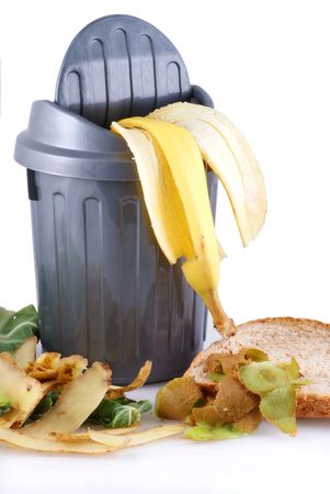 Garbage can with green waste; isolated on a white background.の写真素材