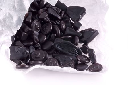 White paper bag filled with typical dutch liquorice.の写真素材