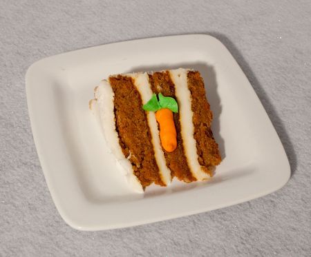 carrot cake on white plateの写真素材