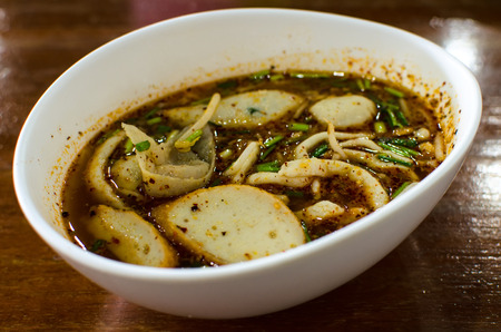 Spicy Fish Noodle With Wonton and Fish Balls  in Tomyum Soup  , Thai Foodの写真素材