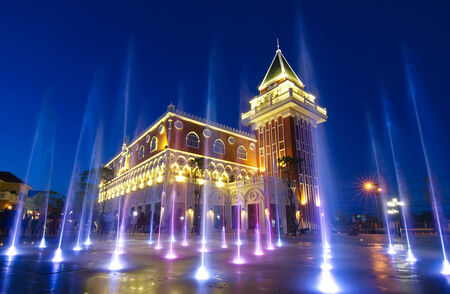 coloured jets water of fountain and the Main Guard building by night in the Venezia Huahin Thailandのeditorial素材