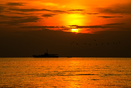Silhouette of Fishing Boat on Sunrise  HuaHin Thailandの写真素材
