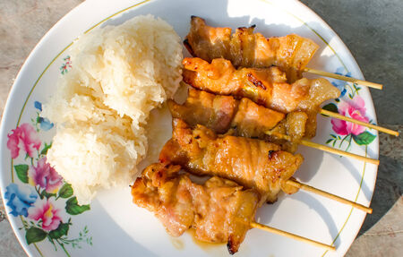 Traditional Thai Style Grilled Pork With Stick Riceの写真素材