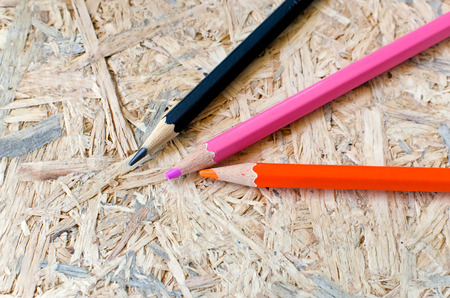 Different colored pencils on wooden backgroundの写真素材