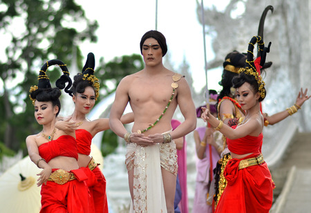 Chiang Rai - July 24   Wat Rong Khun taken on July 24, 2013 Thai traditional Dance on Candle Art Parade Festival  at White Temple,Thailand のeditorial素材
