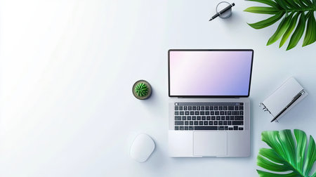 Laptop with an open screen, placed on a minimalist table, surrounded by clean and modern office decorの素材