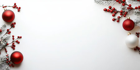 Traditional Christmas baubles and holly berries in a decorative frame on a white background, great for holiday-themed designs and promotions.の素材