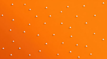 Minimal orange wallpaper with tiny scattered white triangles, clean and trendy background for digital useの素材
