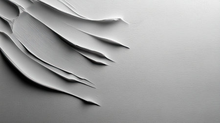 A close-up of a grey texture with fine grain patterns, adding subtle detail and interest to the backdrop.の素材