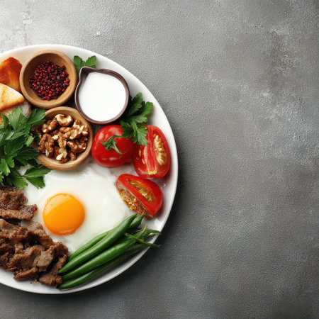 A nutritious breakfast plate featuring eggs, fresh vegetables, and nuts, ideal for healthy eating and morning energy. Perfect for culinary inspiration.の素材