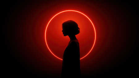 This striking image features the silhouette of a woman against a glowing red halo in a dark setting, creating an atmosphere of mystery and elegance.の素材