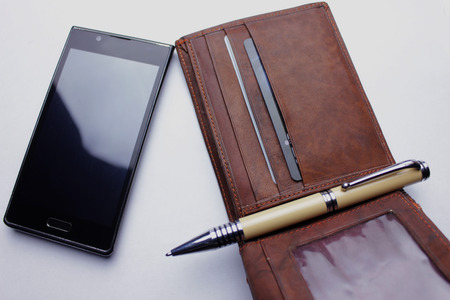 wallet, phone, pen   on white backgroundの写真素材