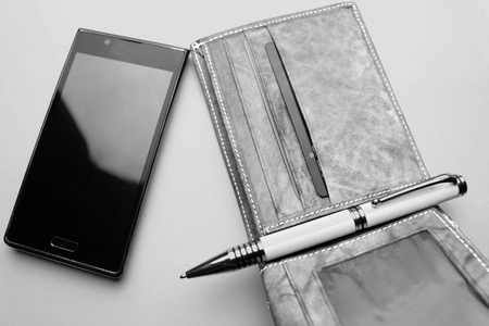 wallet, phone, pen   on white backgroundの写真素材