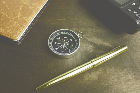 compass and other items on the desktopの写真素材