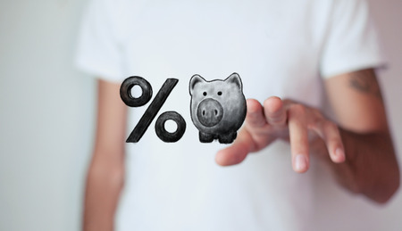 Piggy bank and percent symbolの写真素材