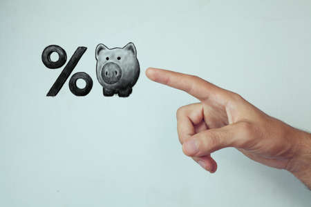 Piggy bank and percent symbolの写真素材